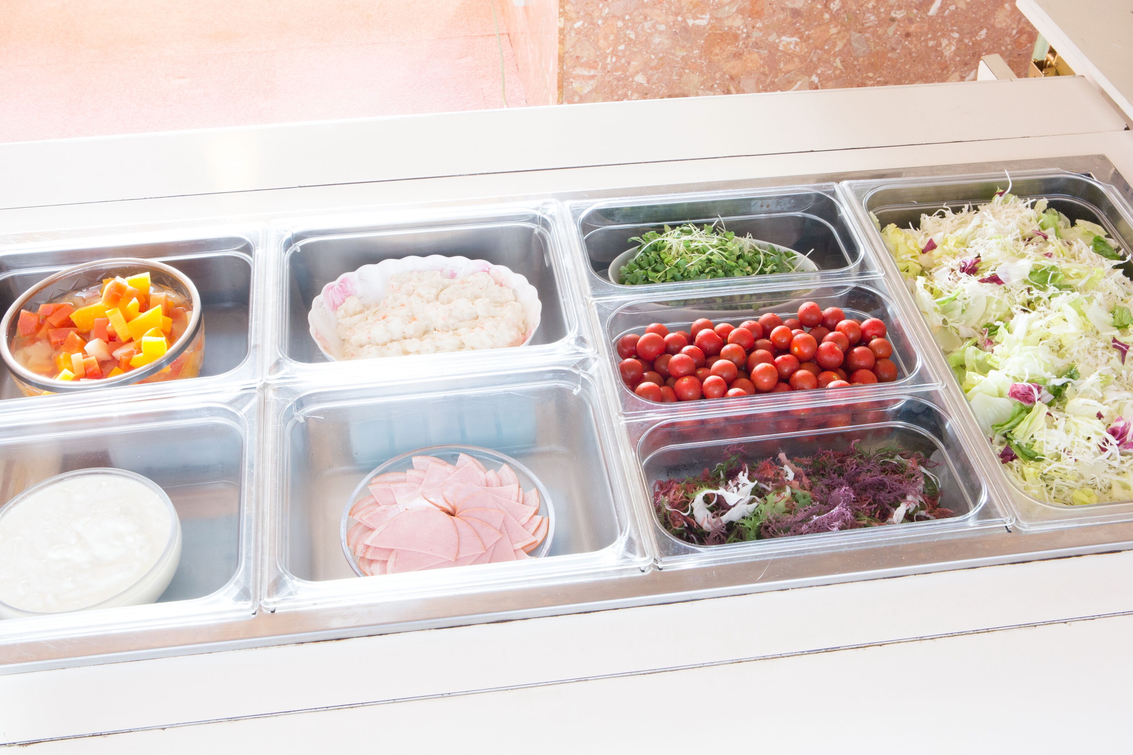 A food display with various items including fruits, vegetables, and meats.