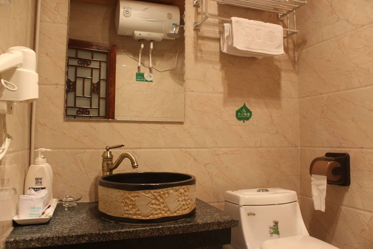 Shower, free toiletries, hair dryer, slippers