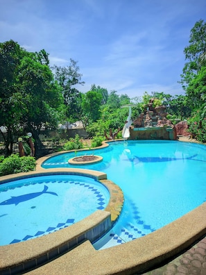 Outdoor pool, pool umbrellas, sun loungers