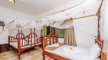 Deluxe Triple Room, Balcony, Sea View | In-room safe, individually decorated, individually furnished, desk
