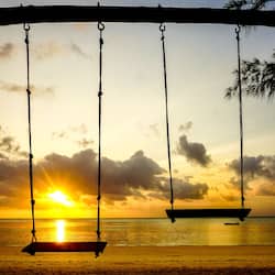 On the beach, white sand, beach towels, beach massages