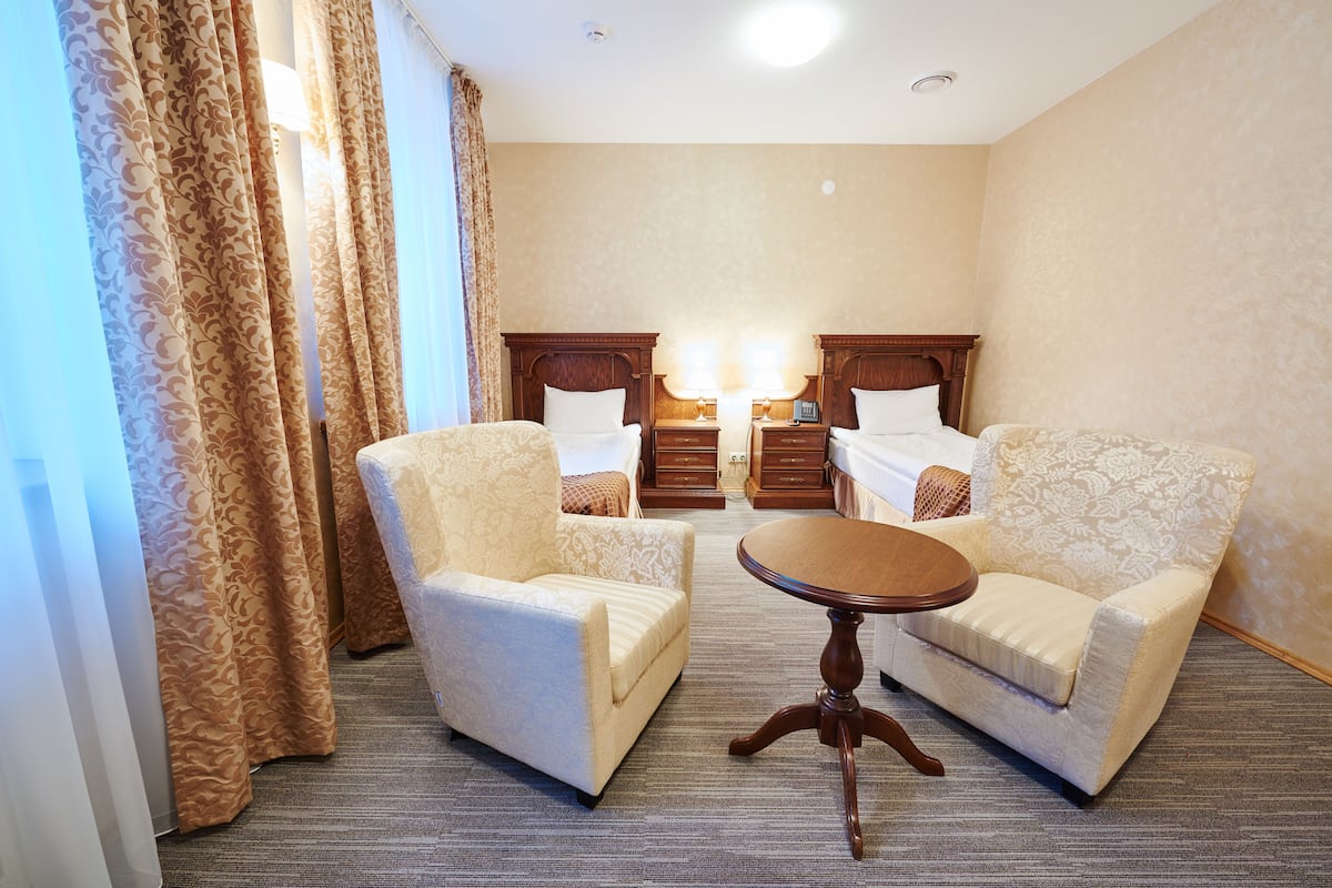 standard twin room, accessible | in-room safe, desk, iron/ironing board, free wifi