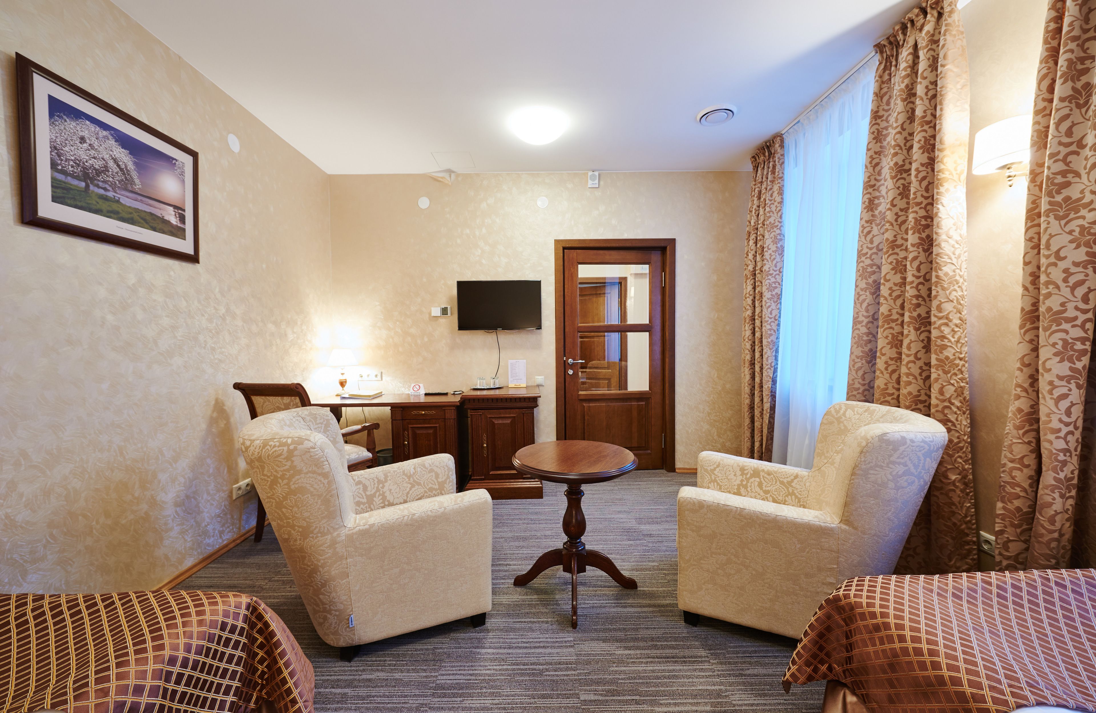 standard twin room, accessible | living area | lcd tv