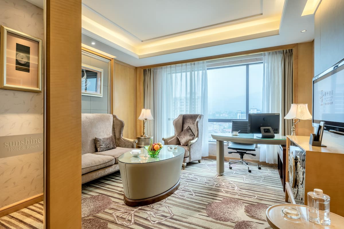 vip suite with living room | minibar, in-room safe, desk, laptop workspace