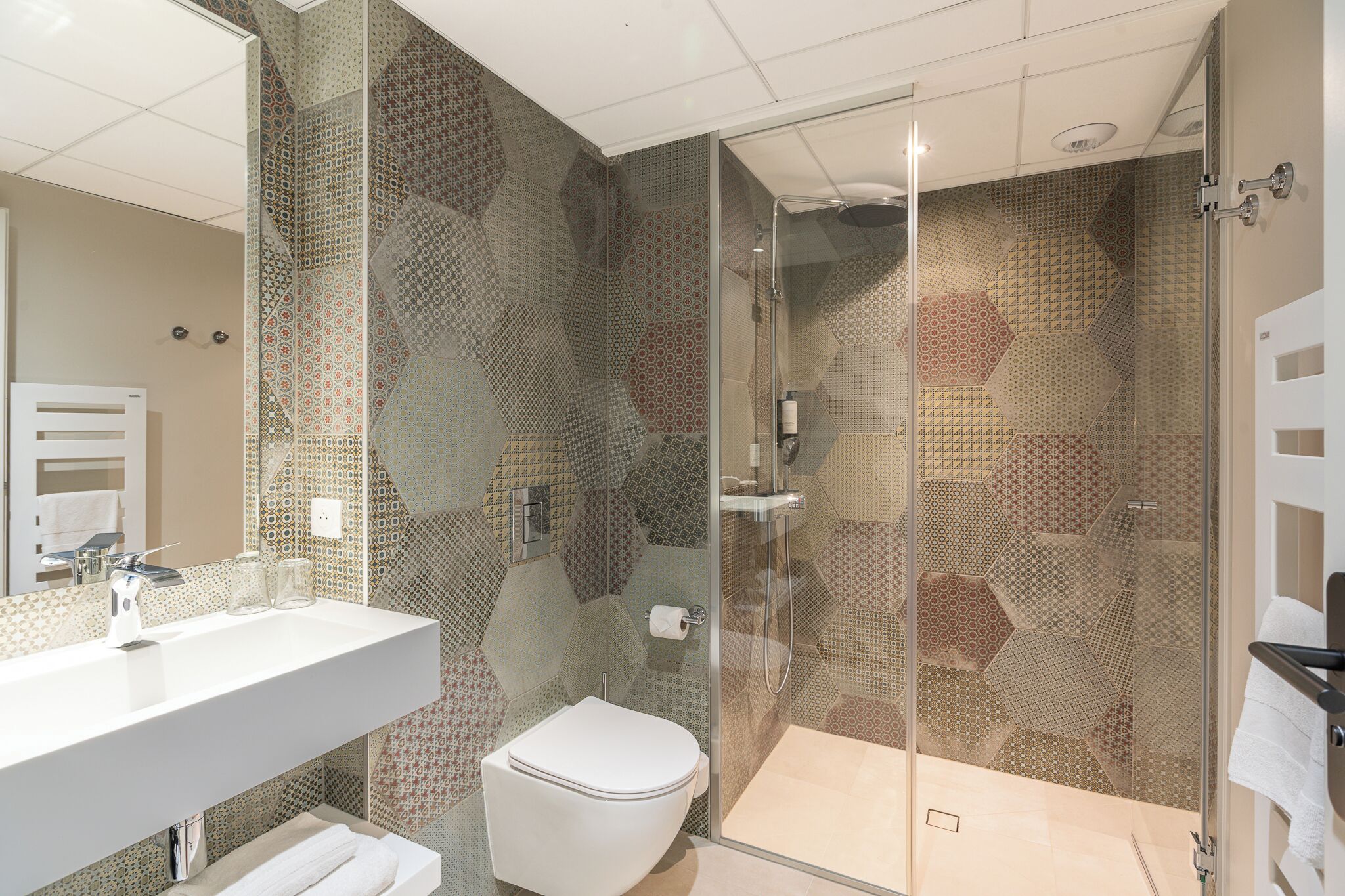 superior double room | bathroom | shower, free toiletries, hair dryer, towels