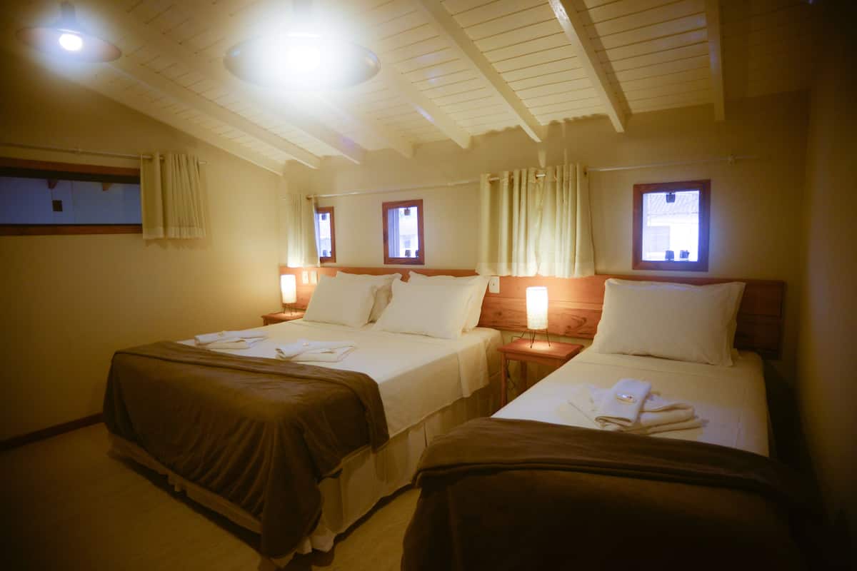Triple Room | Minibar, blackout drapes, WiFi (free), bed sheets