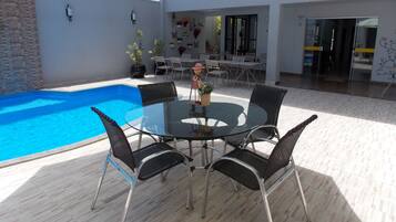 Outdoor pool, pool umbrellas, sun loungers