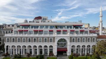 Stunning historic building with a central arched entrance and symmetrical facade.
