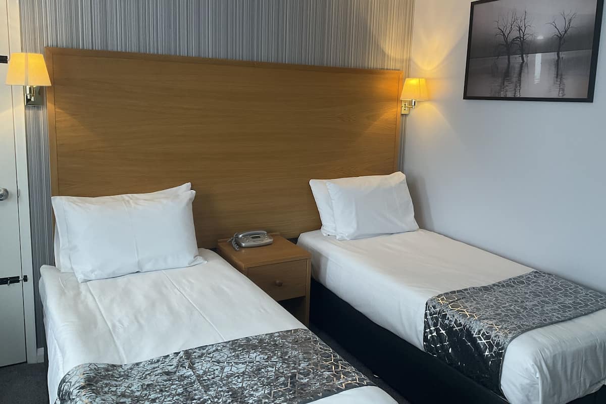 Standaard Twin kamer, en-suite badkamer | 1 slaapkamer, luxe beddengoed, een strijkplank/strijkijzer, gratis wifi