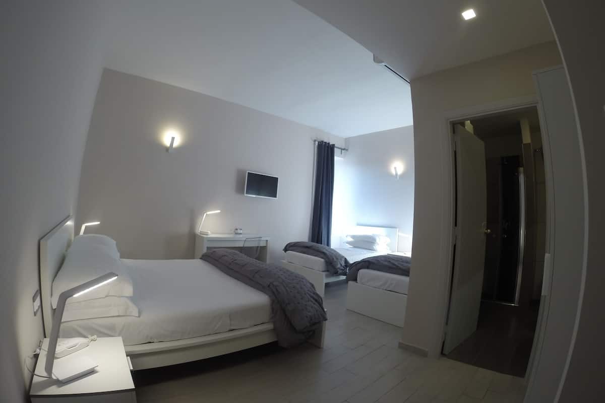 Deluxe Quadruple Room | Premium bedding, down duvets, pillow-top beds, desk
