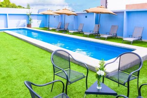 Outdoor pool, pool umbrellas, sun loungers