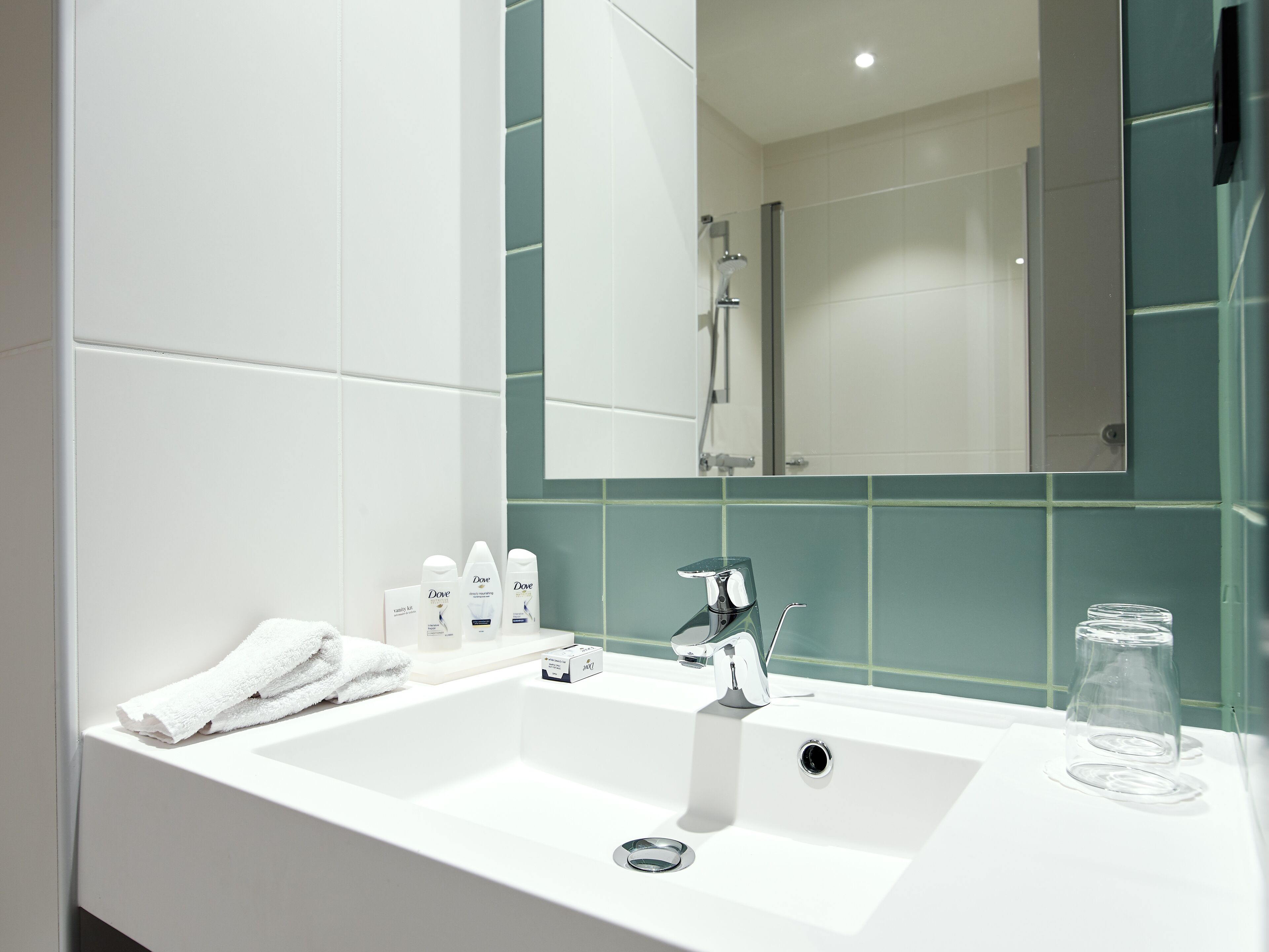 junior suite | bathroom | shower, free toiletries, hair dryer, towels