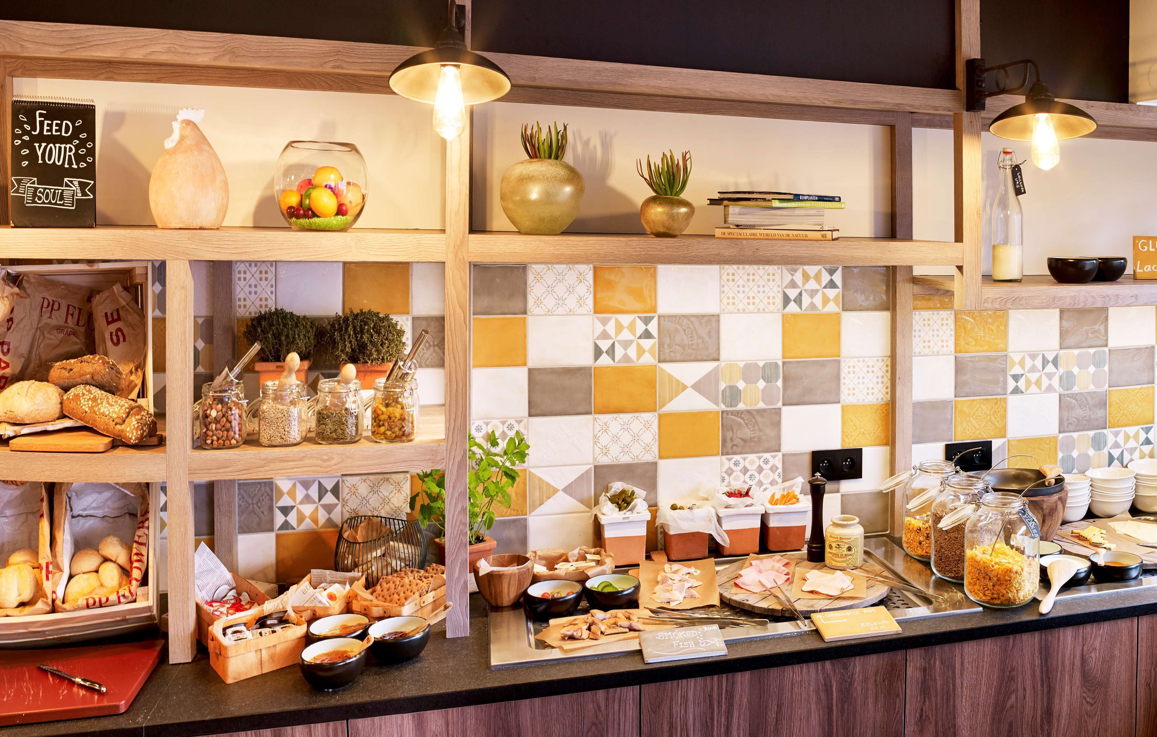 A buffet setup with various food items and condiments.