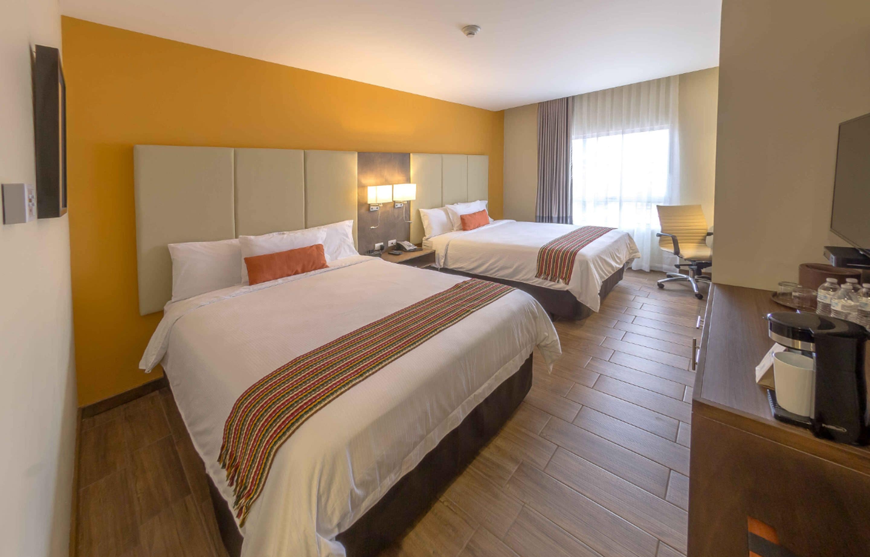 deluxe twin room, city view | in-room safe, desk, iron/ironing board, free wifi