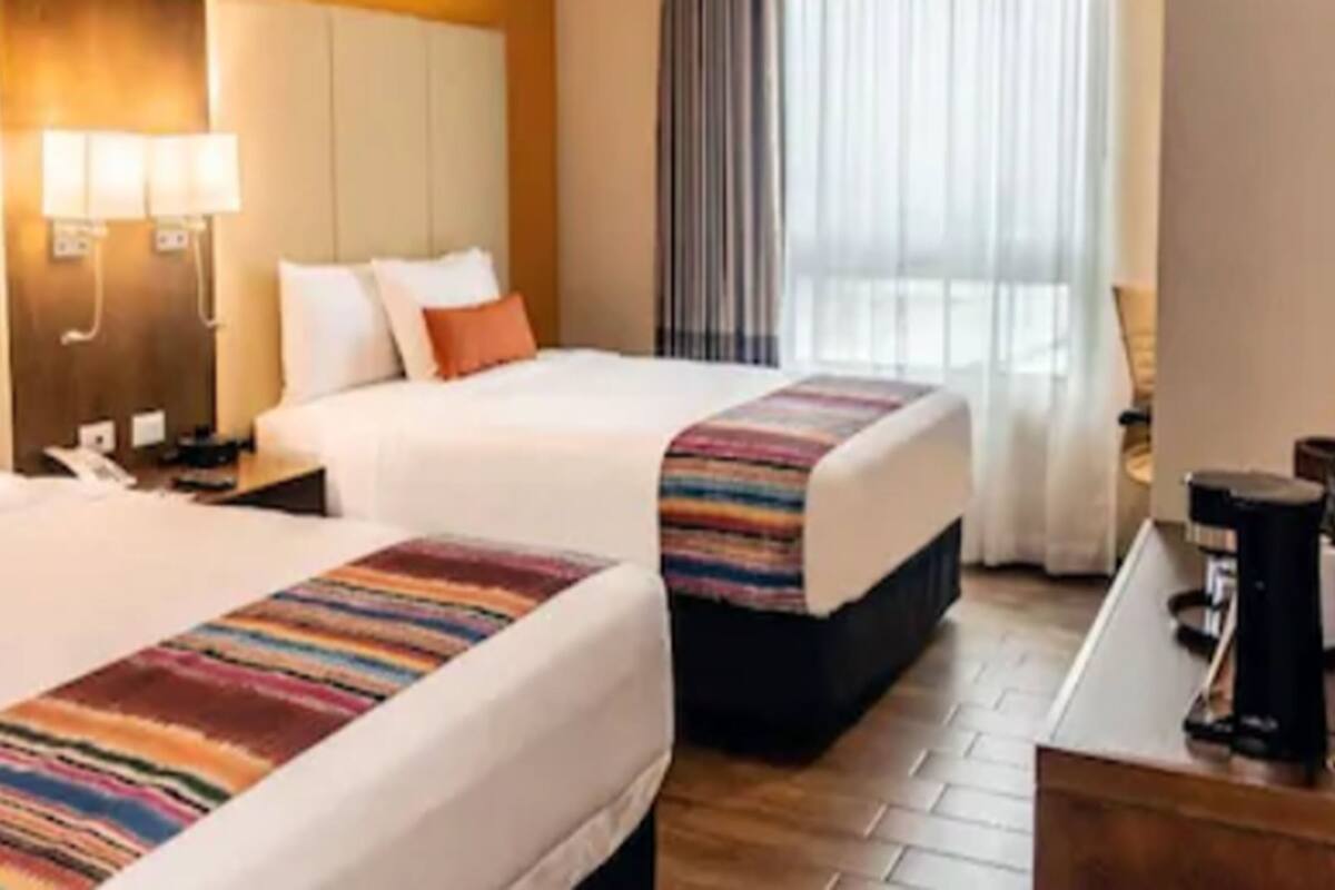 deluxe twin room, city view | in-room safe, desk, iron/ironing board, free wifi