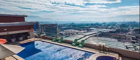 Outdoor pool, pool umbrellas, pool loungers