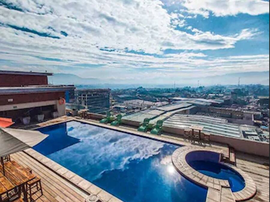 Outdoor pool, pool umbrellas, sun loungers