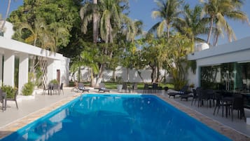 Outdoor pool, open 7:00 AM to 10:00 PM, pool loungers