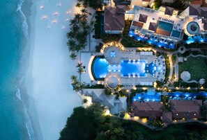 An aerial view of a resort with a large swimming pool, multiple guest rooms, and a beach area. - Sandals Royal Barbados - ALL INCLUSIVE Adults Only (Maxwell)