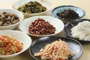 A table with various dishes, including beans, vegetables, and rice. - Bousou Shirahama Umisato Hotel (Minamiboso)