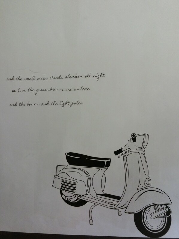 A drawing of a scooter with a seat and handlebars.