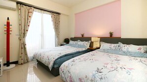 A hotel room with two beds, a large window with curtains, a bedside table with a lamp, and a wall with a pink panel. - Luckystar B&B (Luodong)