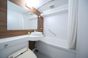 Une salle de bain moderne avec un lavabo blanc, un miroir et une douche.