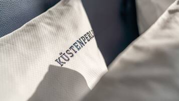 A pillow with the text "KÜSTENBERG" on it.