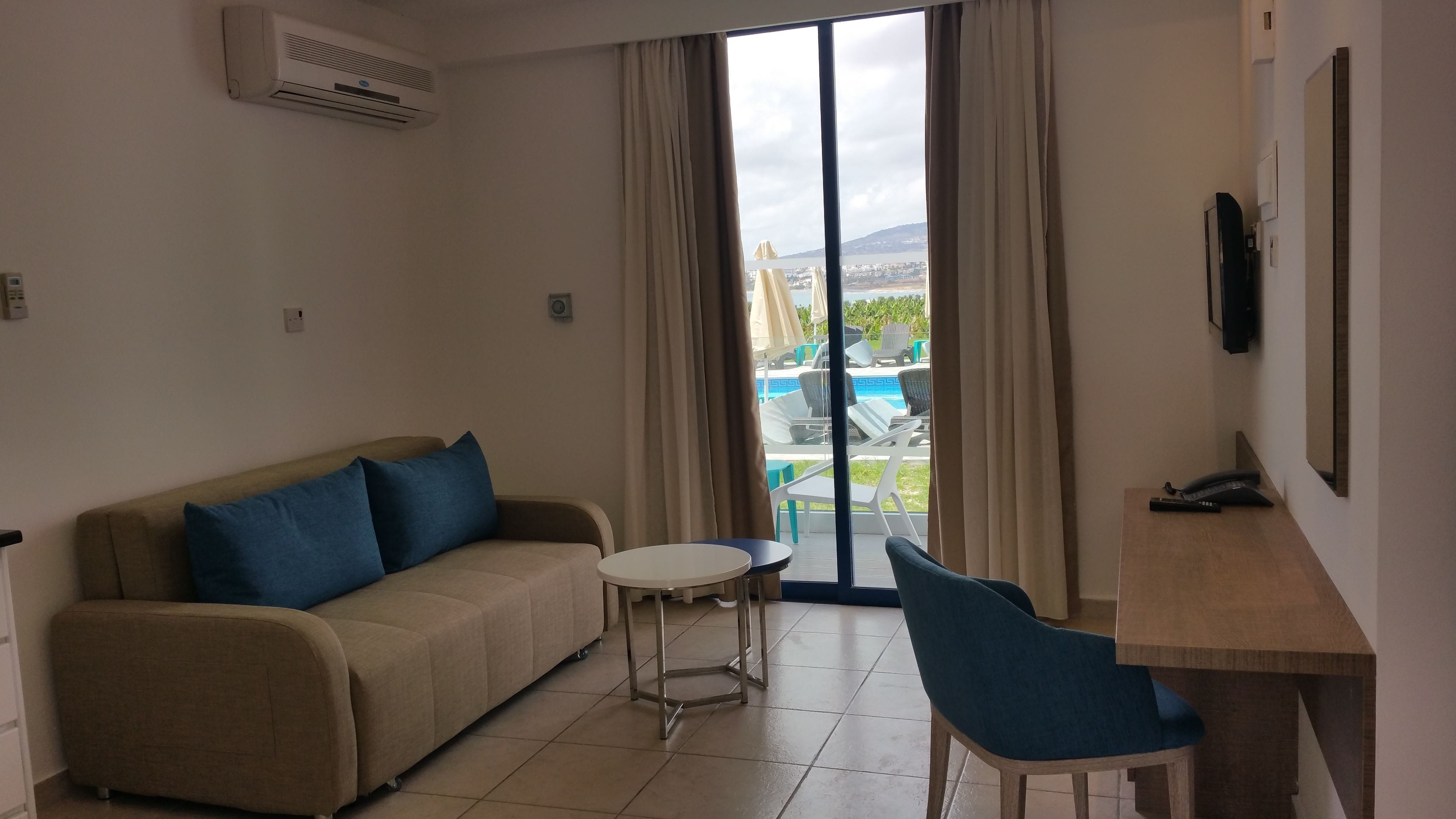 Suite, 1 Bedroom (Sea & Pool View) | Living room | TV