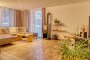 Luxury Apartment, 3 Bedrooms, Accessible, Garden Area | Living area | Flat-screen TV, DVD player, table tennis, heated floors - Matterhorngruss Apartments (Zermatt)