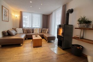 Luxury Apartment, 3 Bedrooms, Accessible, Garden Area | Living area | Flat-screen TV, DVD player, ping pong, heated floors - Matterhorngruss Apartments (Zermatt)
