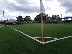 A soccer field with a goalpost and a white flag. - JUFA Hotel Graz Süd - Self Check-in (Graz)