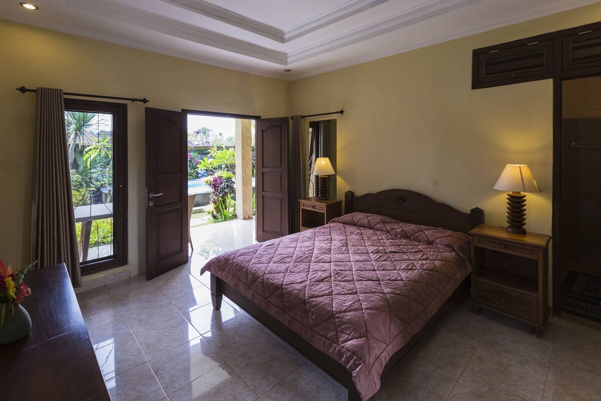 Kamar Double Deluks, 1 Tempat Tidur Double, pemandangan kebun | 4 kamar tidur, brankas, dan Wi-Fi gratis
