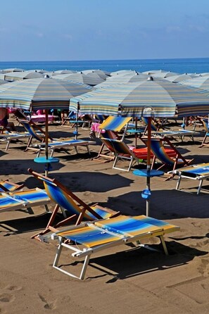 Private beach nearby, beach umbrellas
