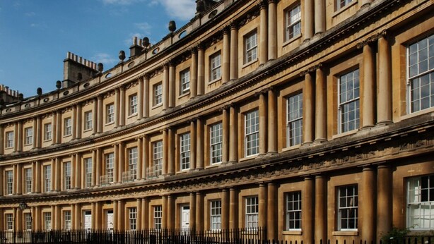 A row of classical buildings with uniform windows and columns, suggesting a historic architectural style. - Bath Circle (Bath)