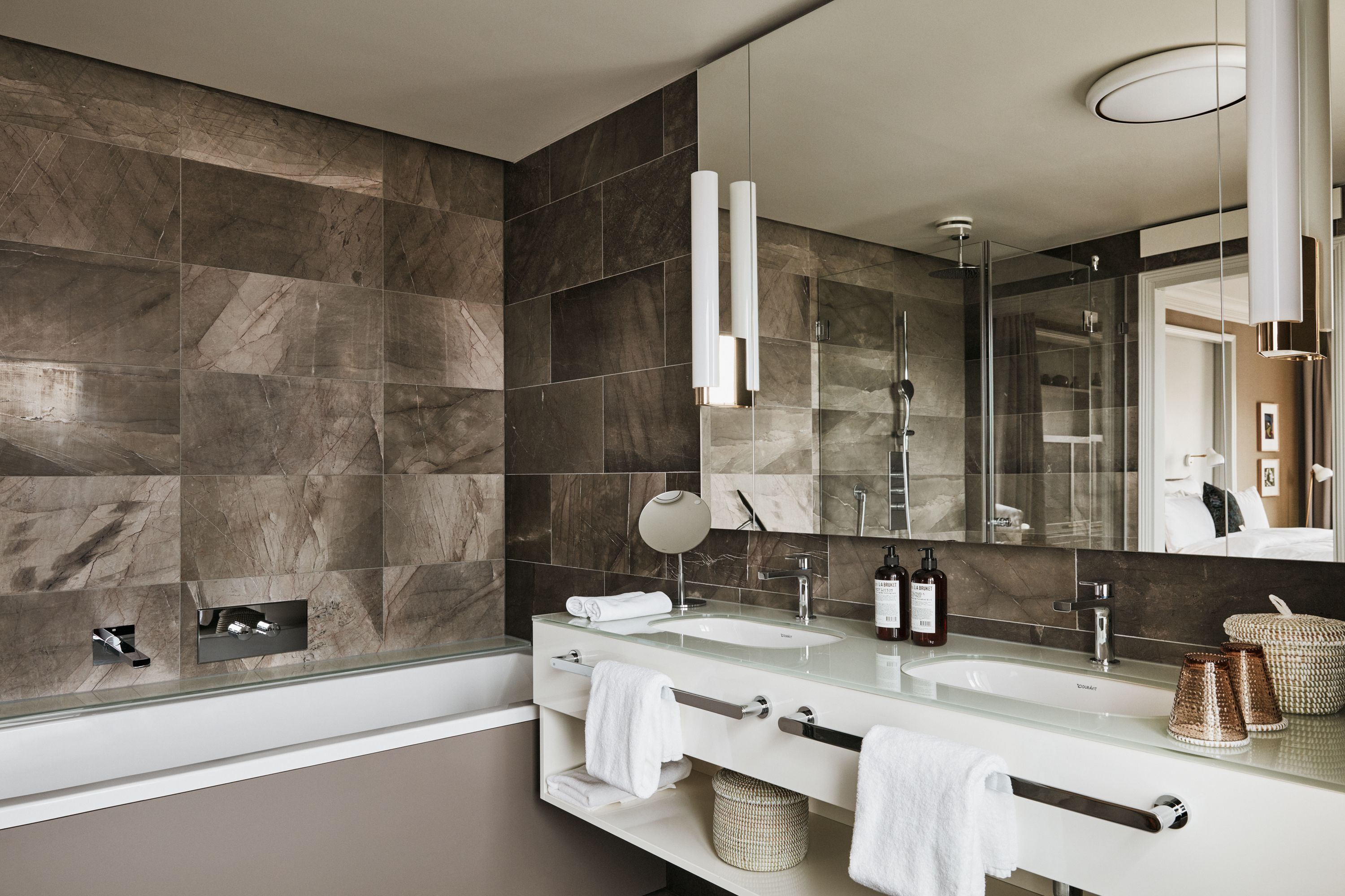 designer toiletries, hair dryer, bathrobes, slippers