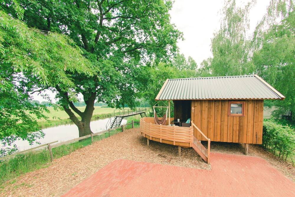 Cottage with terrace on the river De Regge