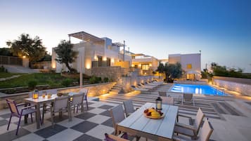 Seasonal outdoor pool, open 10:00 AM to 8:00 PM, pool umbrellas