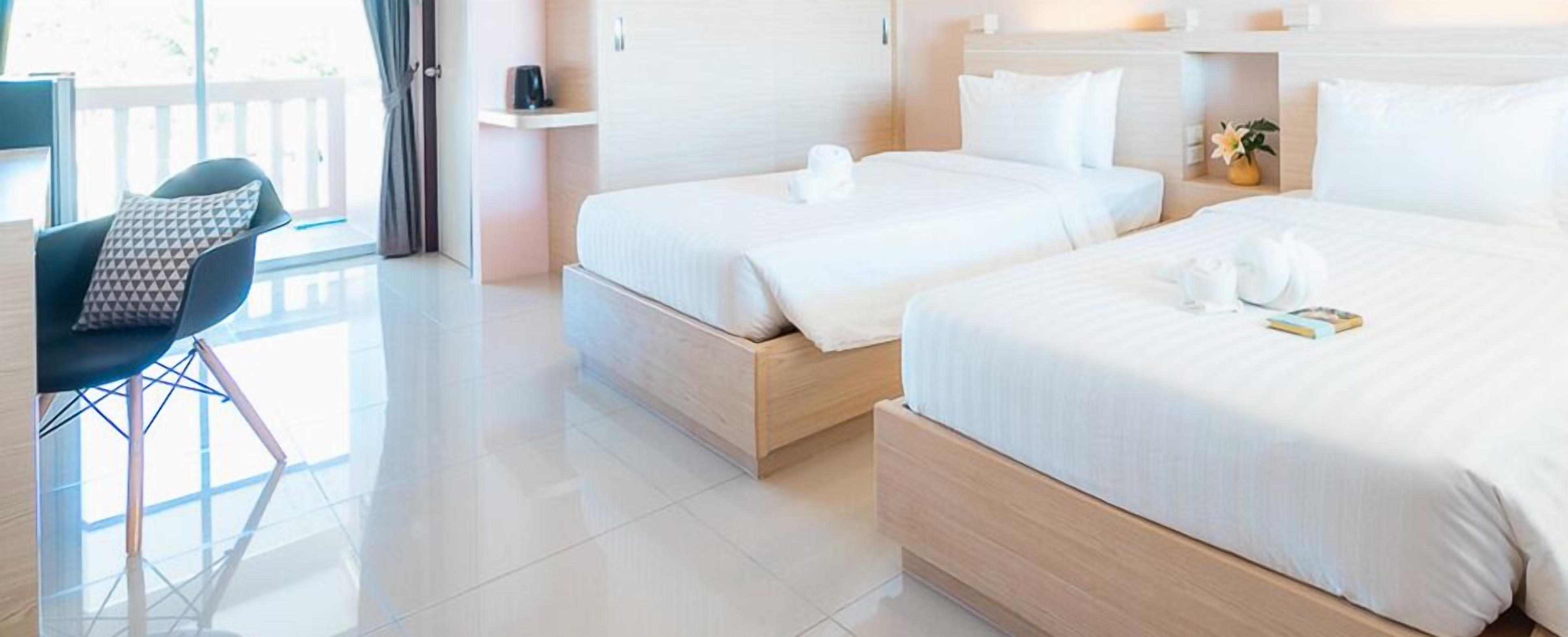 standard twin room, 2 single beds, non smoking, garden view | premium bedding, minibar, individually decorated, desk