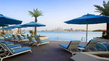 Outdoor pool, pool umbrellas, sun loungers