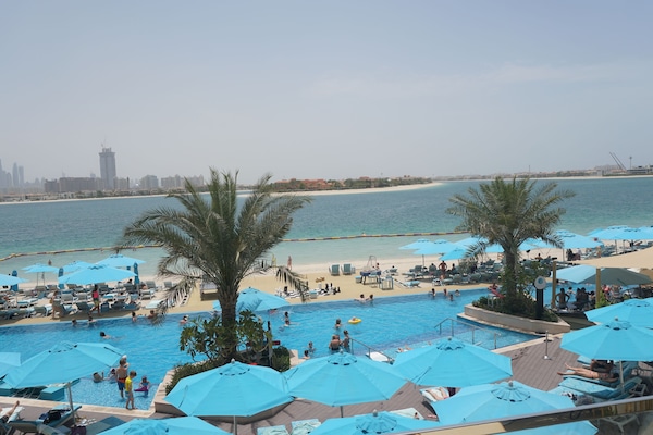 On the beach, sun loungers, beach umbrellas, beach towels