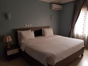 Deluxe Suite, 1 Bedroom | In-room safe, desk, iron/ironing board, free WiFi - Emzrel Hotel & Suites (Abuja)