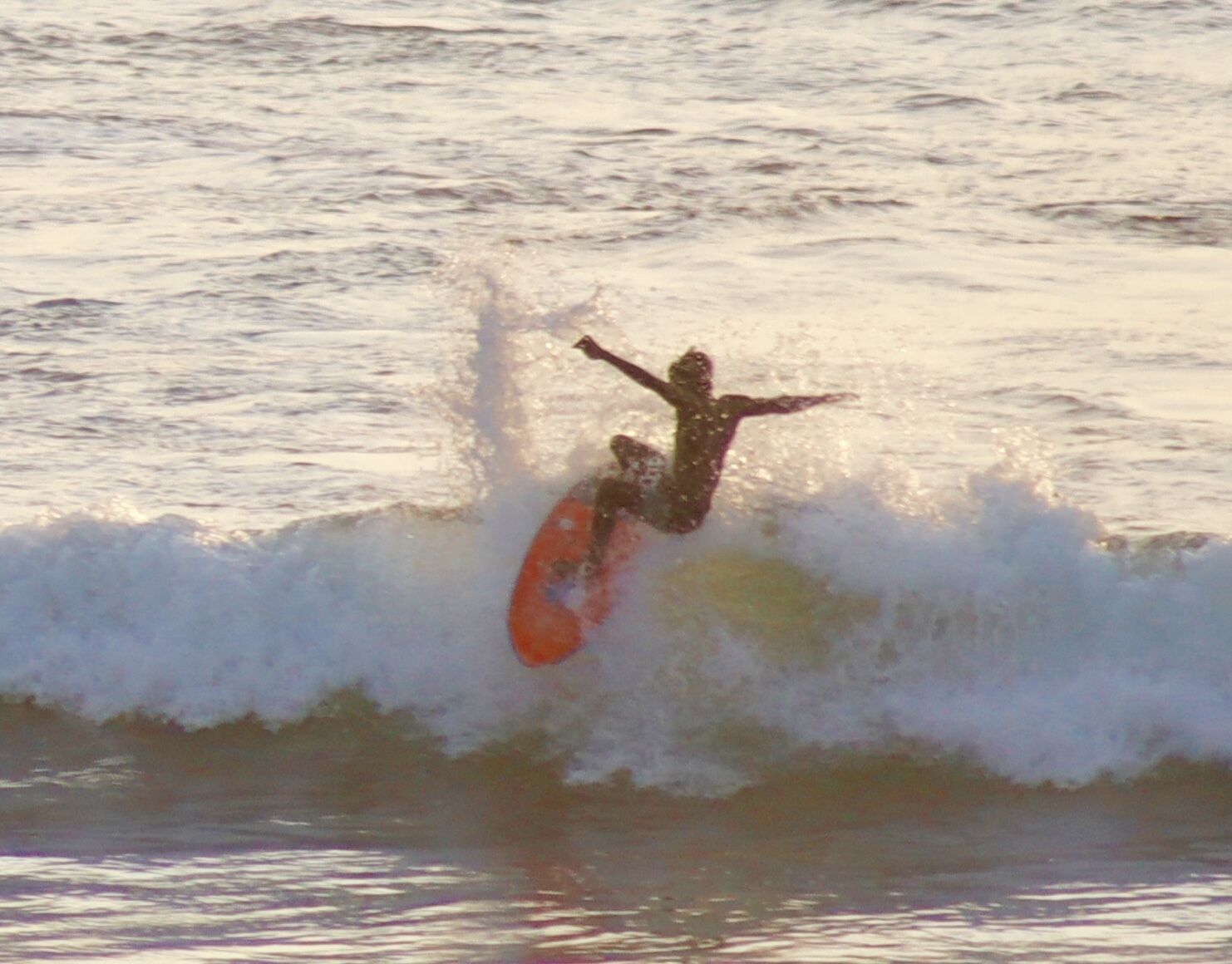 A person surfing on a wave.
