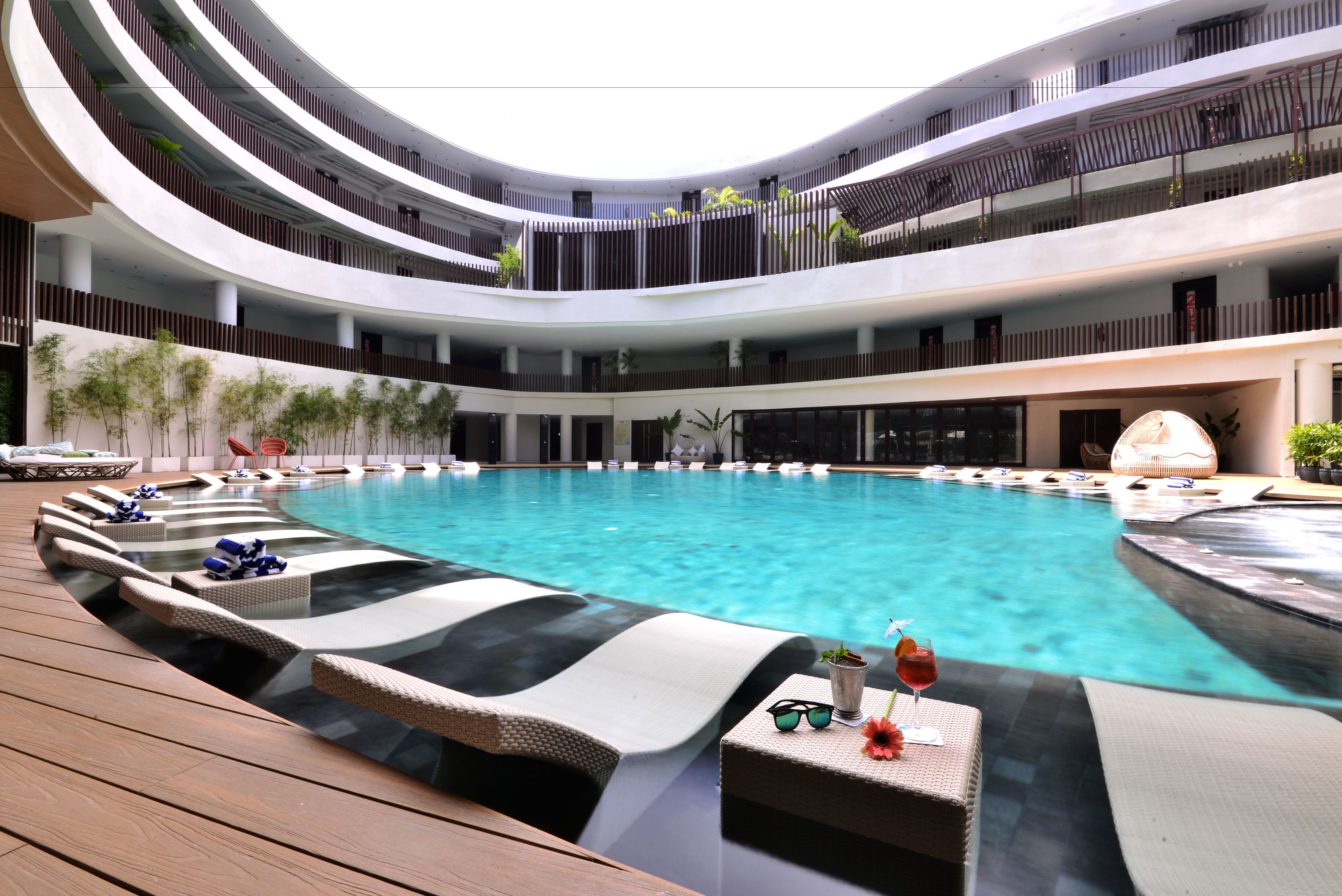 indoor pool, open 9 am to 10 pm, pool umbrellas, pool loungers