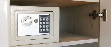 A safe with a keypad and a combination lock.