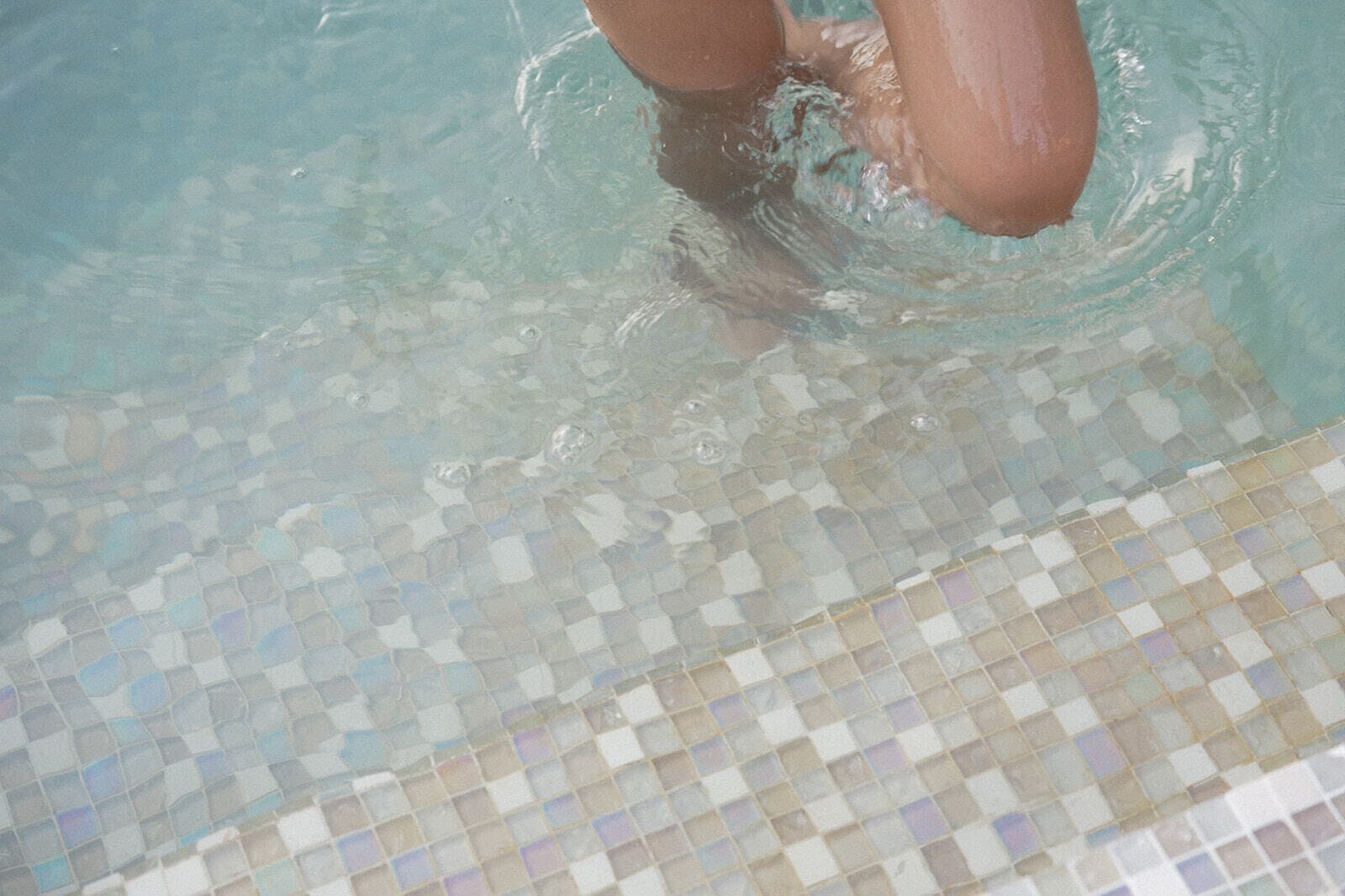 A pool with a tiled floor.