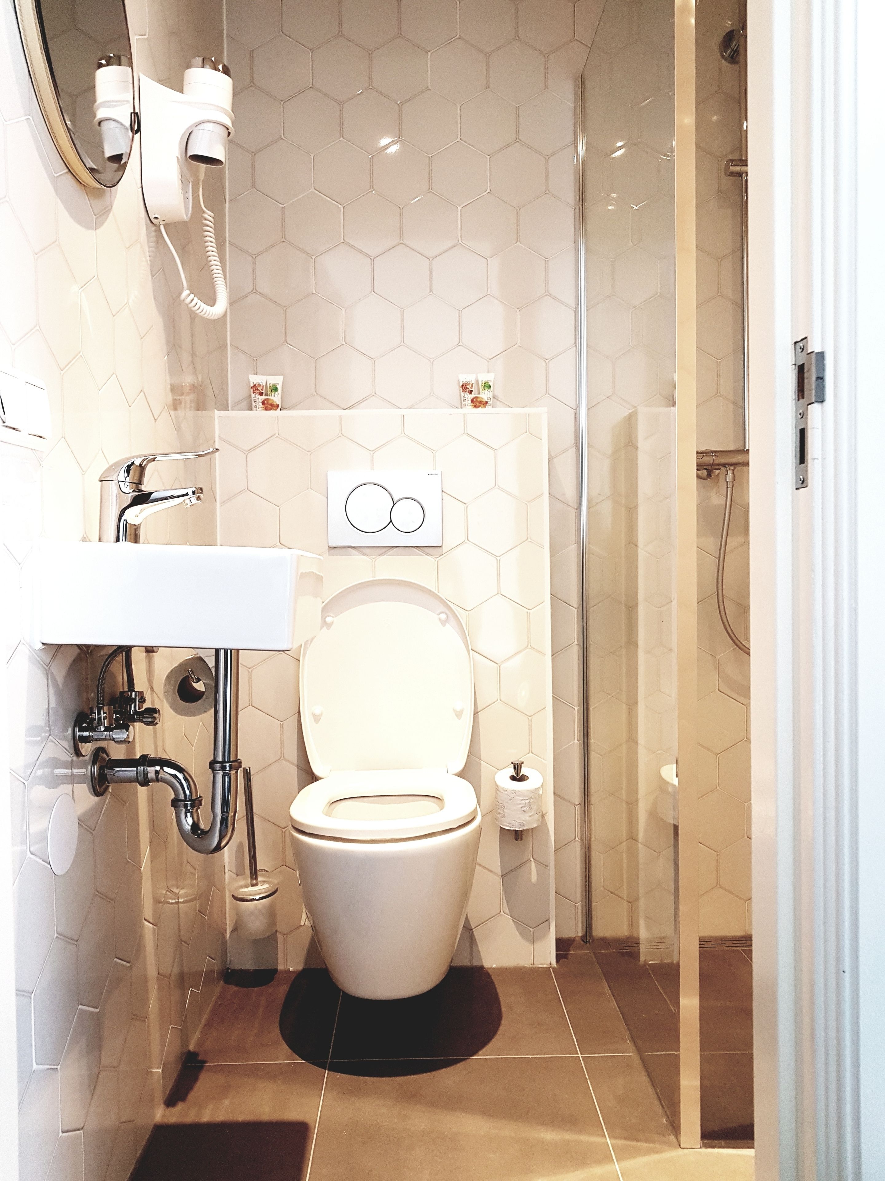 economy double room | bathroom | shower, free toiletries, hair dryer, towels