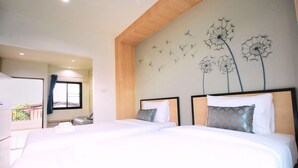 A hotel room with two beds, a wooden ceiling, and a wall mural of dandelions. - Sirimunta Hotel Chiang Rai (Chiang Rai)