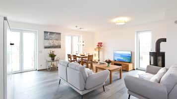 Apartment, 2 Bedrooms (Grosses Meer) | Living area | 32-inch TV with satellite channels, fireplace, DVD player