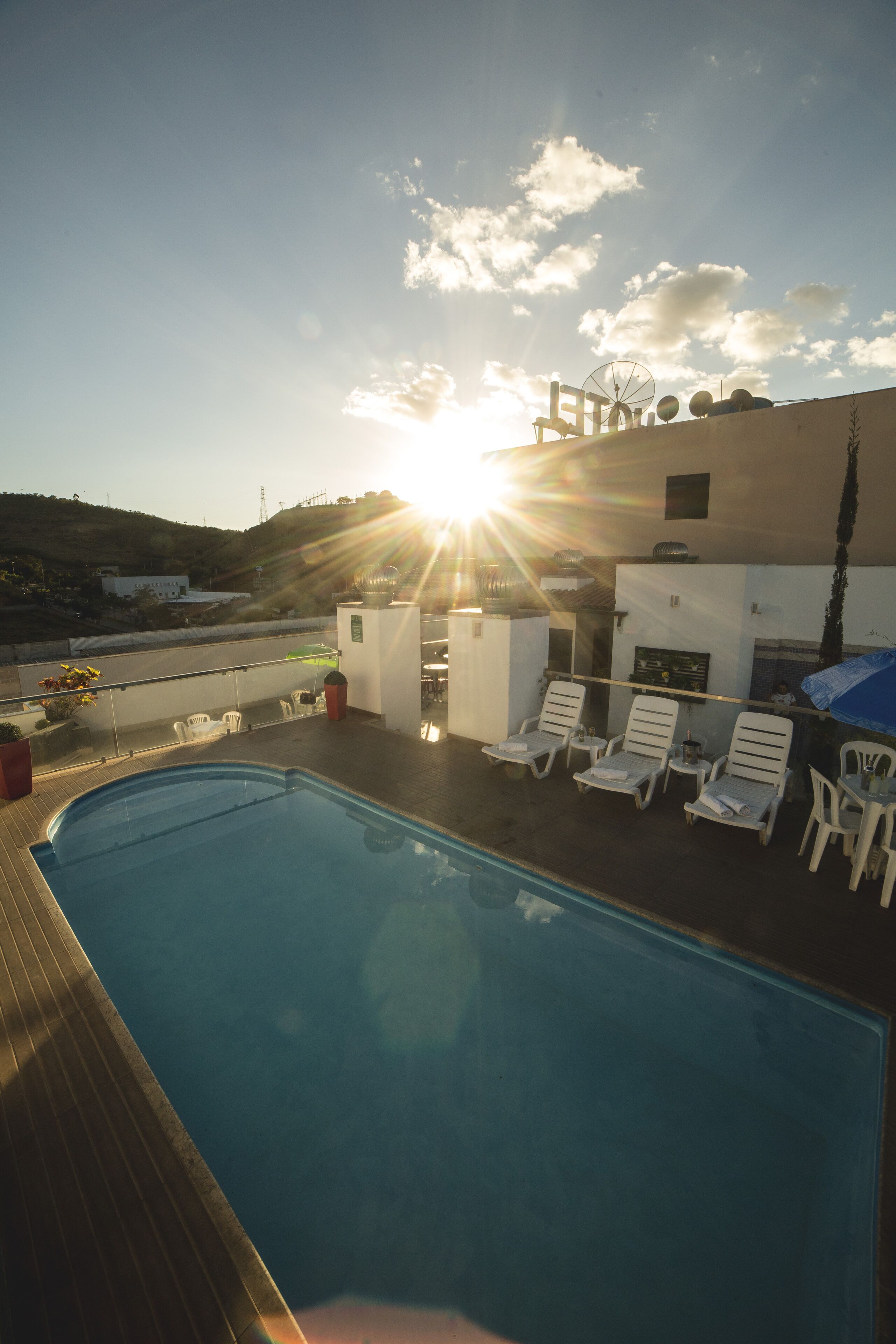 outdoor pool, open 10:00 am to 9:30 pm, pool loungers